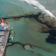 Oil leaks from the MV Wakashio, a bulk carrier ship that ran aground on a coral reef off the southeast coast of Mauritius, last August.
